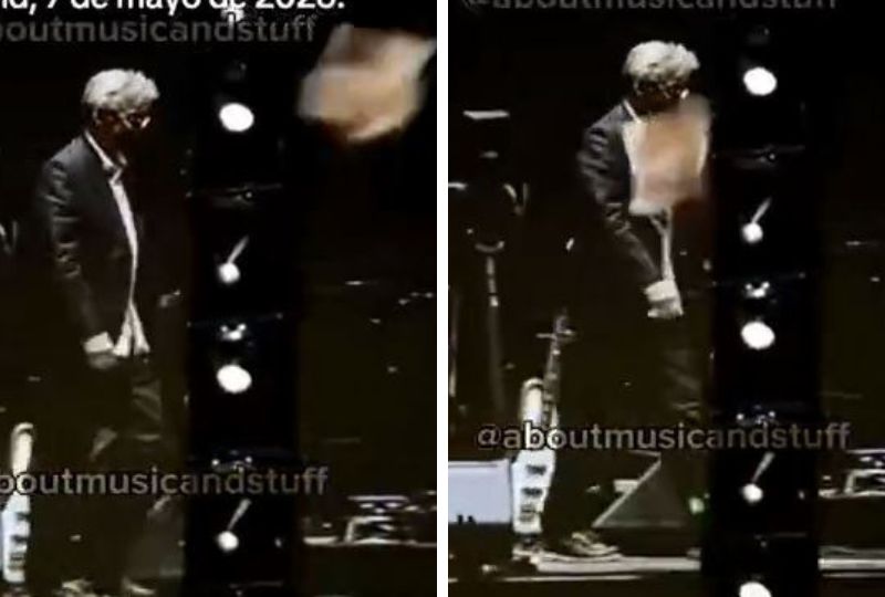 Musician Eric Clapton walks off stage after being hit by object